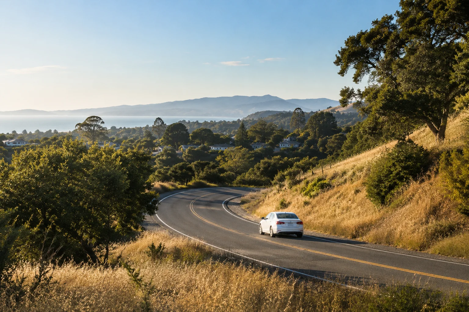 Generated editorial image of a white car on a winding road through sunlit California hills