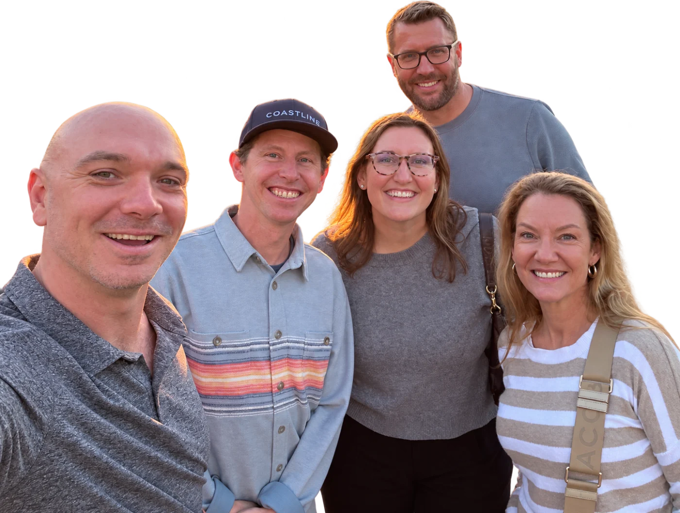 Five members of the Coastline team smiling together
